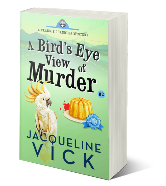 A light green paperback cover featuring a cockatoo. The title reads A Bird's Eye View of Murder by Author Jacqueline Vick.